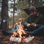 Outdoor setting, campfire, bushcraft tools