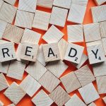 Scrabble pieces spelling "READY" representing How to Start Prepping for Beginners