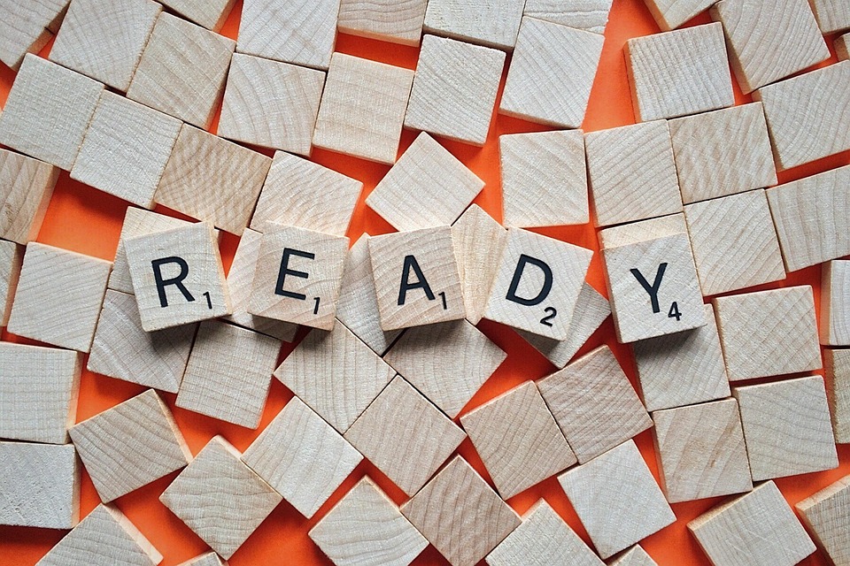 Scrabble pieces spelling "READY" representing How to Start Prepping for Beginners