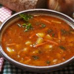 A bowl of soup or stew, representing cooking in a power outage