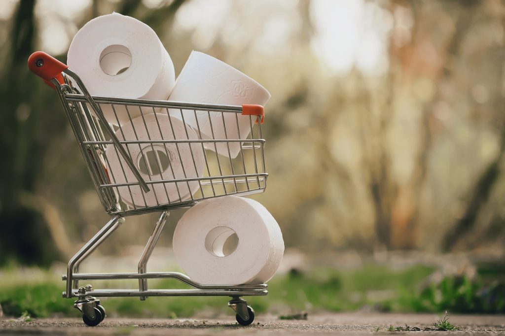 A shopping cart with toilet paper in it